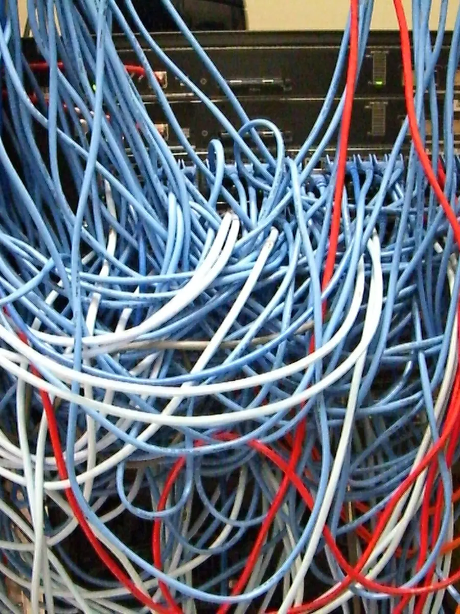 Bundles of network cable running down a server rack