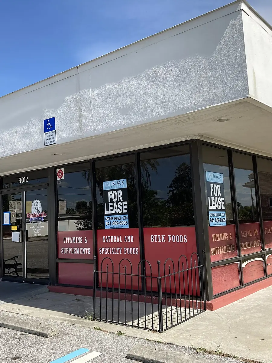 A closed shop with letting notices in its windows