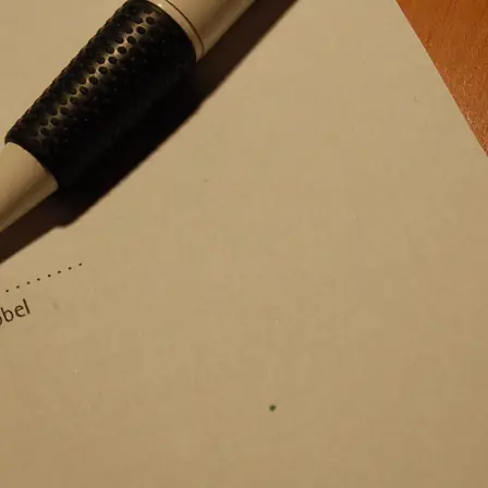 A signature at the foot of a printed contract page