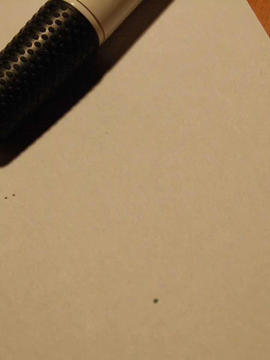 A signature at the foot of a printed contract page