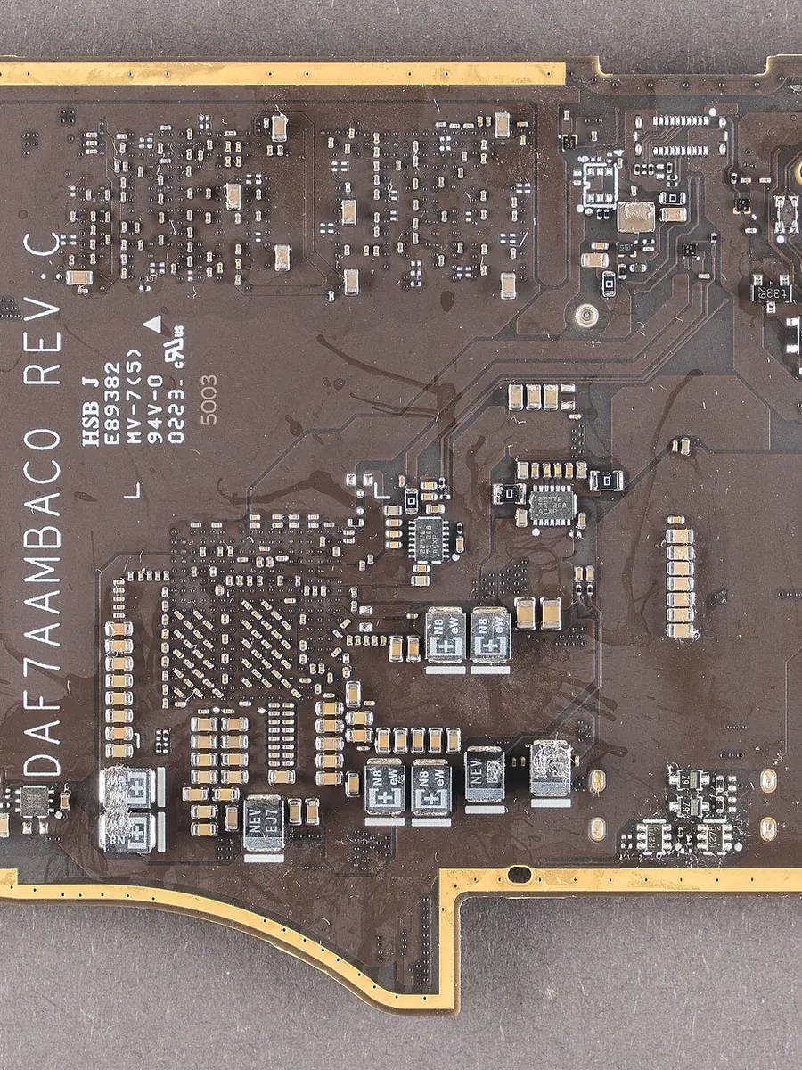 The mainboard of a handheld gaming PC with its processor exposed
