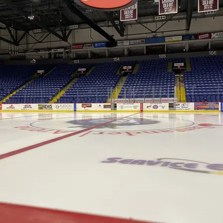 An empty arena with tiered seating before an event