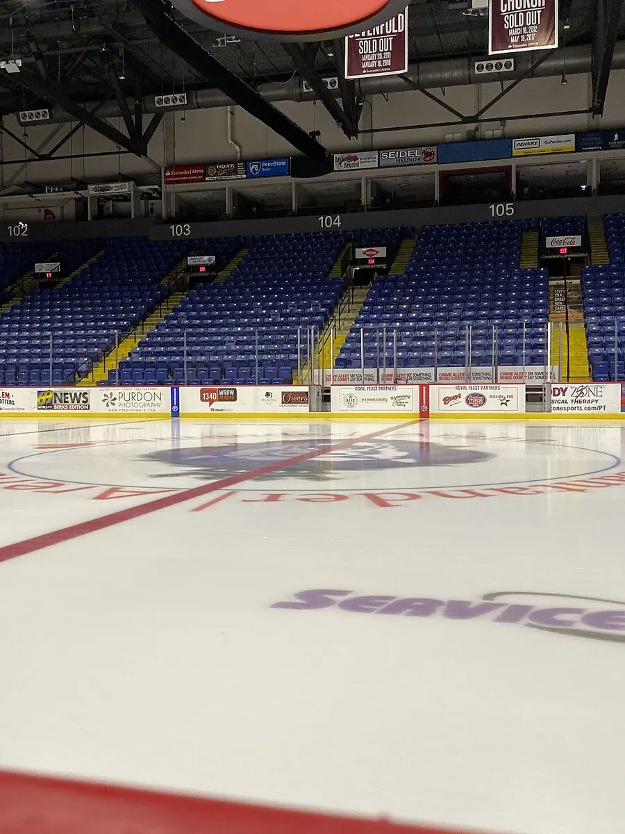 An empty arena with tiered seating before an event
