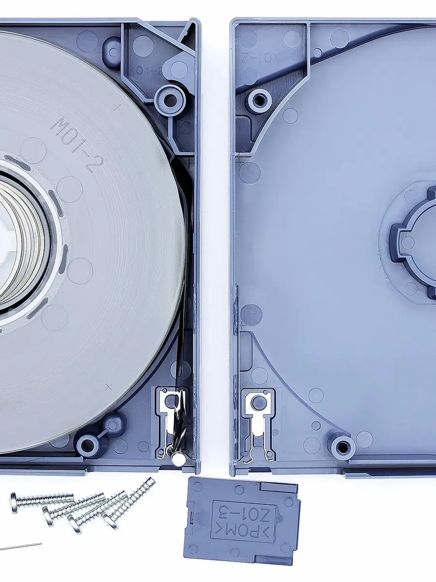 An LTO data tape cartridge opened to show the tape inside