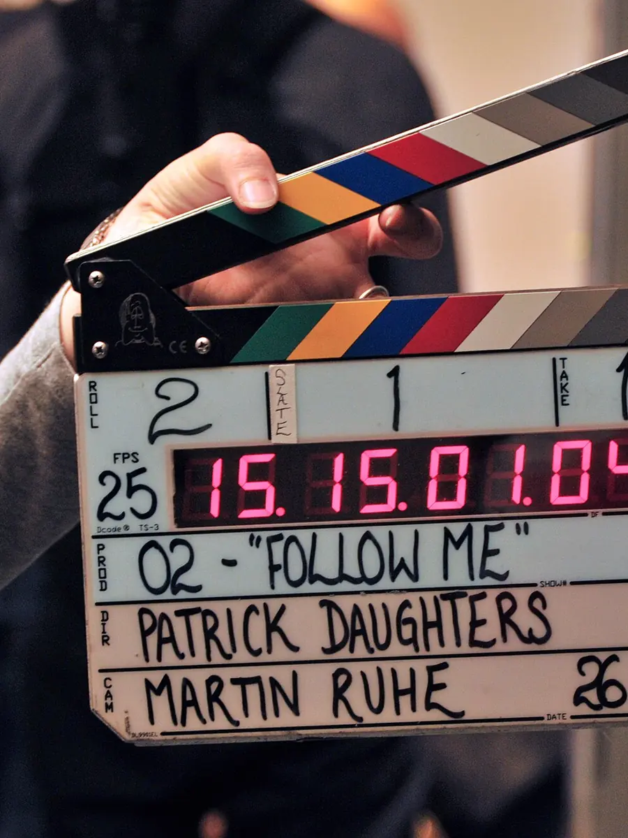 A clapperboard marked with scene and take numbers