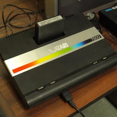 An Atari console with a cartridge inserted